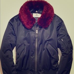 Coach Bomber jacket with red shearling trim